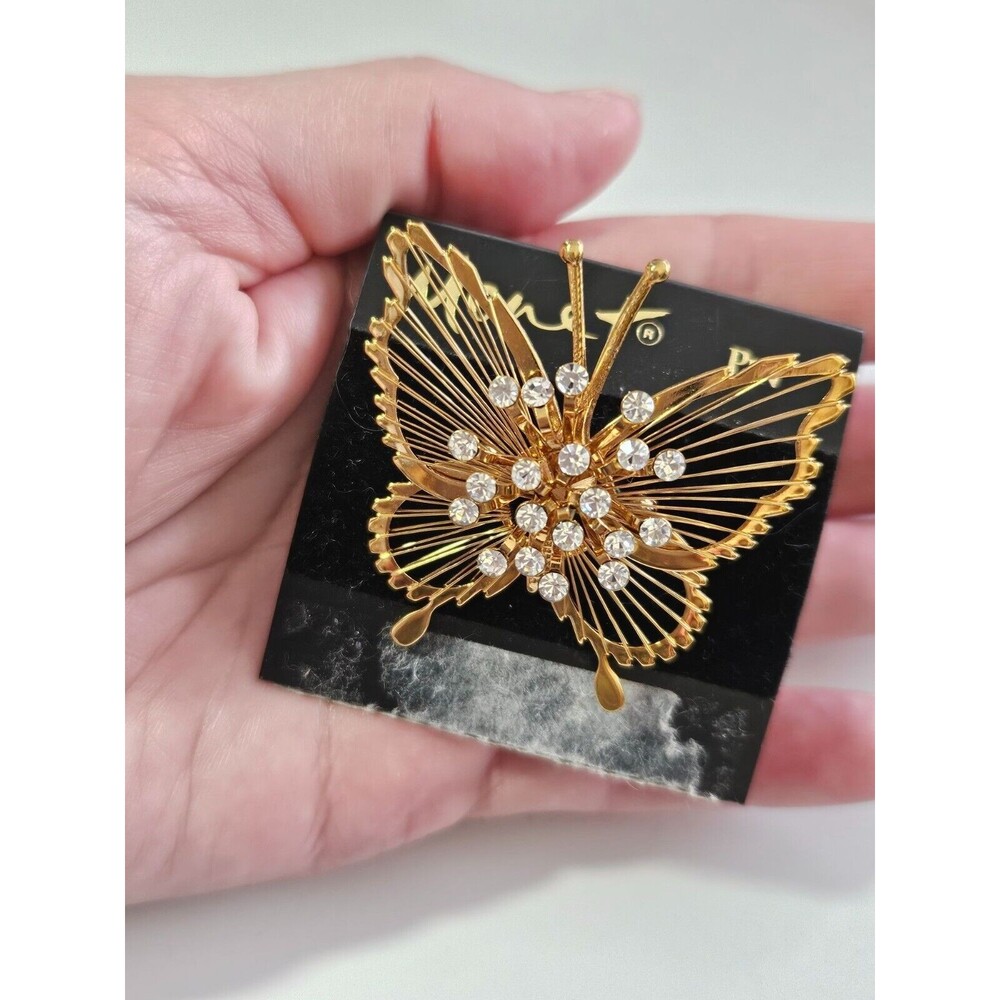 Monet gold tone butterfly brooch